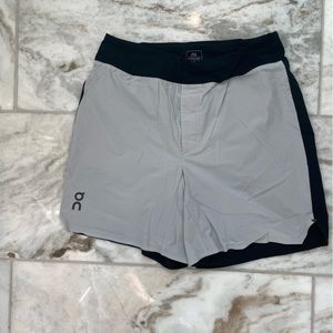 Men’s on-running short. White and black. Small. Brief liner. 7” inseam